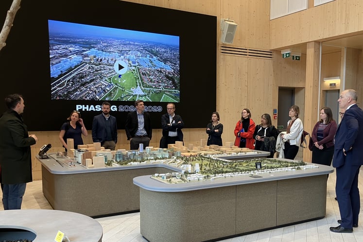 Group of people surrounding a model of Brent Cross Town