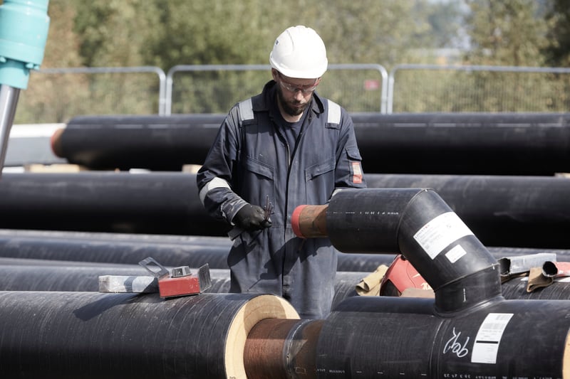 Engineer working on pipe